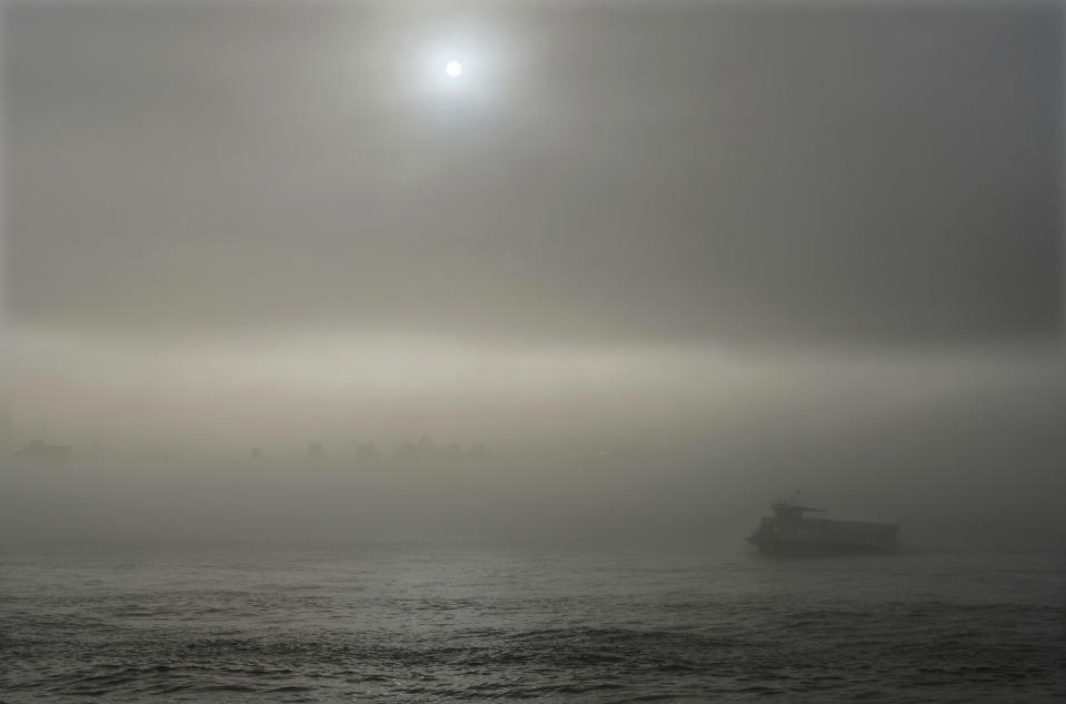 A passenger ferry makes its way between Hoboken, N.J., and Manhattan, Wednesday, April 5, 2017, on the Hudson River after a minor derailment on Monday at Penn Station involving a New Jersey Transit train caused commuter problems in the New York City metro area. Buses and New York Waterway ferries are honoring NJ Transit's rail tickets. (AP Photo/Denis Paquin)