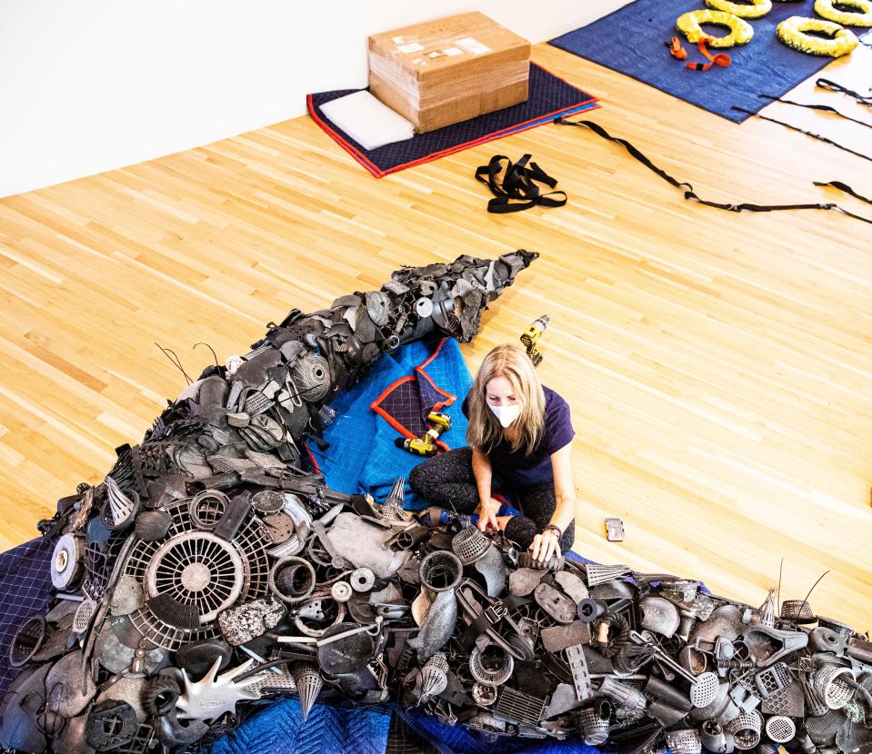 Artist Pam Longobardi works on a sculpture made from debris found on beaches all around the world including Alaska, Hawaii, Costa Rica, California, Indonesia and the Gulf of Mexico at the Baker Museum in Naples. The exhibit is  called "Ocean Gleanings.Ó It runs through mid July. 