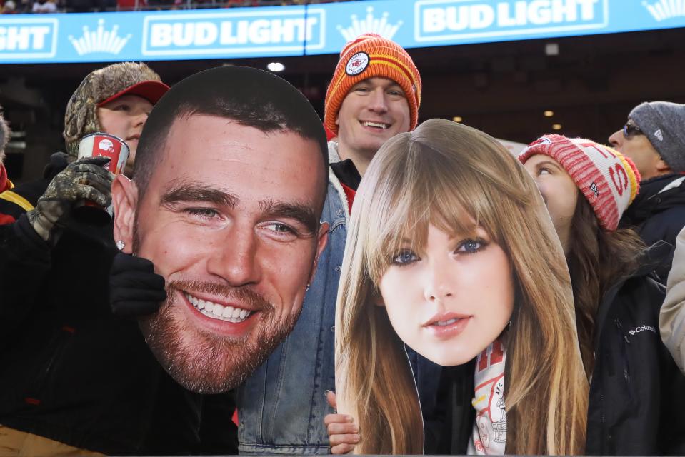 Fanmade signs of Swift and Kelce at the Chiefs v. Bengals game on Dec 31, 2023