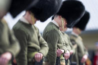 Soldiers from the Welsh Guards bow their heads as they rehearse for Britain's Prince Philip's funeral on the Drill Square at the Army Training Centre Pirbright in Woking, Surrey, England Wednesday April 14, 2021. Prince Philip's funeral will be held at Windsor Castle on Saturday following his death at the age of 99 on April 10. (Victoria Jones/PA via AP)