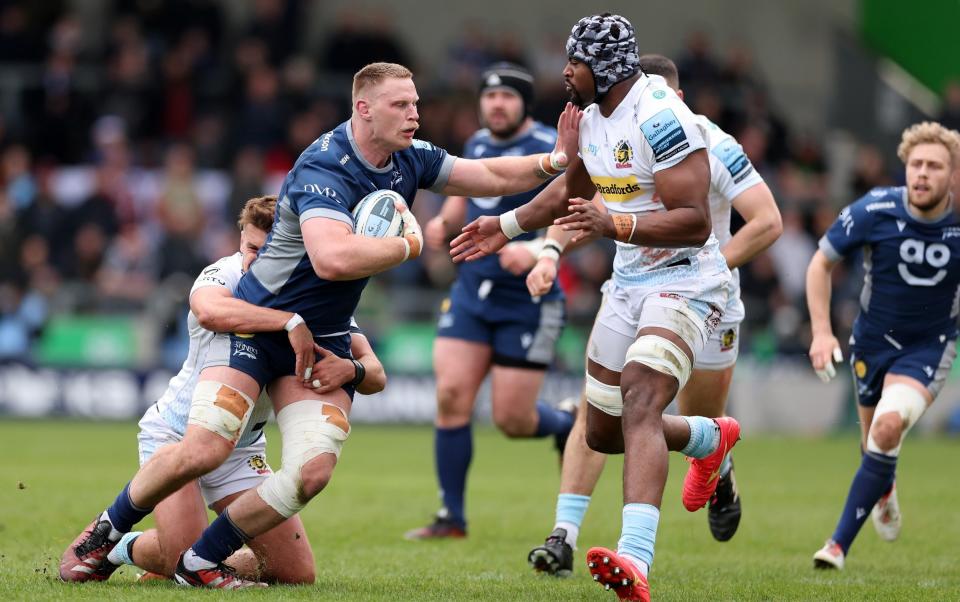 Jean-Luc du Preez of Sale Sharks runs towards Christ Tshiunza of Exeter Chiefs during the Gallagher Premiership Rugby match between Sale Sharks and Exeter Chiefs at AJ Bell Stadium on March 31, 2024 in Salford, England
