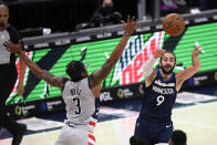 Minnesota Timberwolves guard Ricky Rubio (9) passes against Washington Wizards guard Bradley Beal (3) during the second half of an NBA basketball game, Saturday, Feb. 27, 2021, in Washington. (AP Photo/Nick Wass)