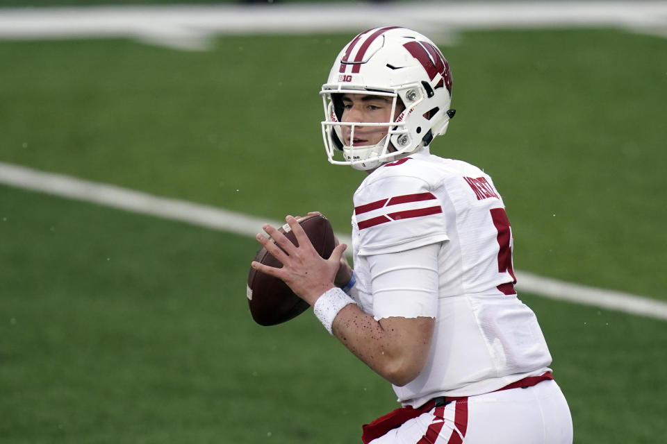 FILE - In this Dec. 12, 2020, file photo, Wisconsin quarterback Graham Mertz throws a pass during an NCAA college football game against Iowa in Iowa City, Iowa. Mertz heads into his third season as a starter knowing he must develop into a more reliable performer(AP Photo/Charlie Neibergall, File)