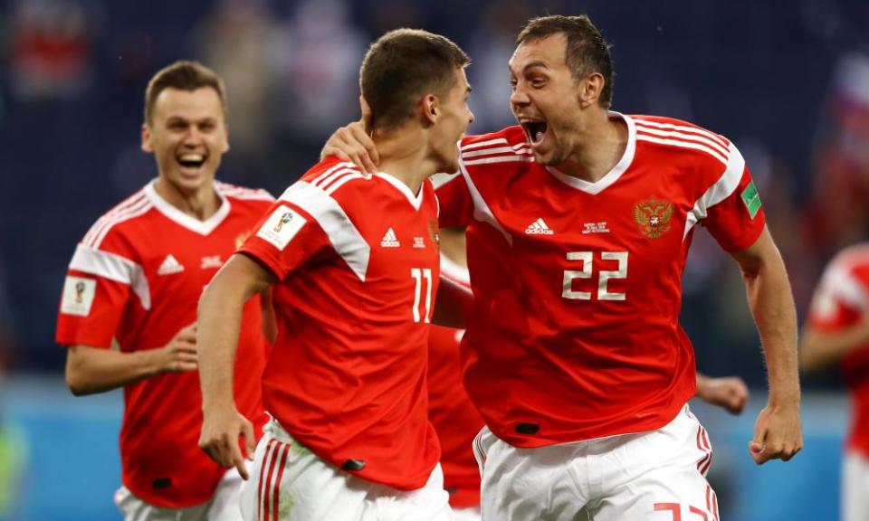 Russia, who have won their first two World Cup matches, celebrate their opening goal against Egypt. 
