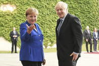 Germany's Chancellor Angela Merkel meets with British Prime Minister Boris Johnson, in Berlin, Wednesday, Aug. 21, 2019. German Chancellor Angela Merkel says she plans to discuss with UK Prime Minister Boris Johnson how Britain's exit from the European Union can be "as frictionless as possible." (Jorg Carstensen/dpa via AP)
