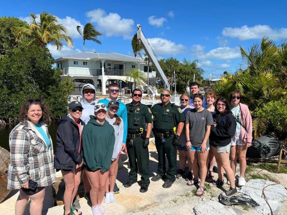 Missouri students gather for a photo with Monroe County Sheriff’s Office deputies who met them Monday, Jan. 29, 2024, to pick up a brick of cocaine while they volunteered to collect along the Florida Keys shoreline.