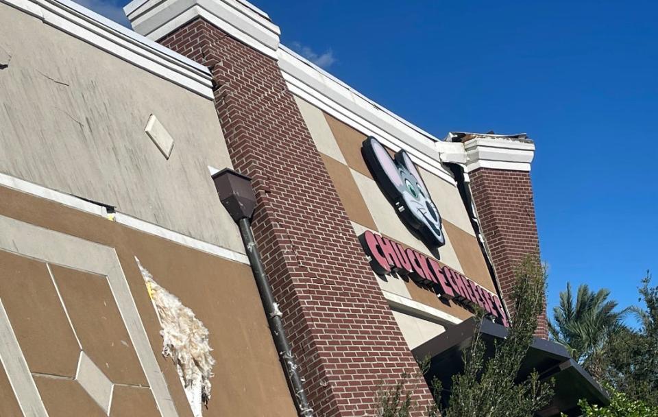 This is a view of the exterior of the Chuck E. Cheese restaurant/arcade at The Pavilion at Port Orange on Friday, Sept. 30, 2022. The standalone kids-oriented restaurant at 5539 S. Williamson Blvd. was extensively damaged when the roof collapsed during Tropical Storm Ian on Thursday.