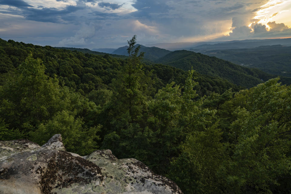 This July 2019 photo provided by The Nature Conservancy shows a sunset overlooking the rolling Appalachian mountains at Flag Rock Recreation Area in Norton, Va. The Cumberland Forest Project protects 253,000 acres of Appalachian forest in Tennessee, Kentucky, and Virginia and is one of TNC's largest-ever conservation efforts in the eastern United States. (Steven David Johnson/The Nature Conservancy via AP)