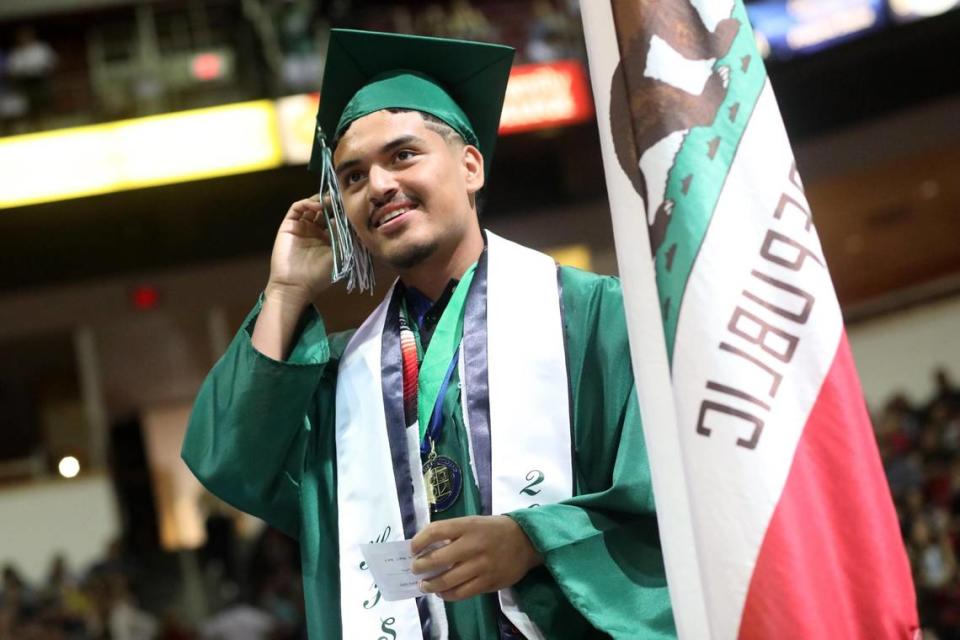 A graduate during the Hoover High graduation ceremony held at the Save Mart Center on June 6, 2023.