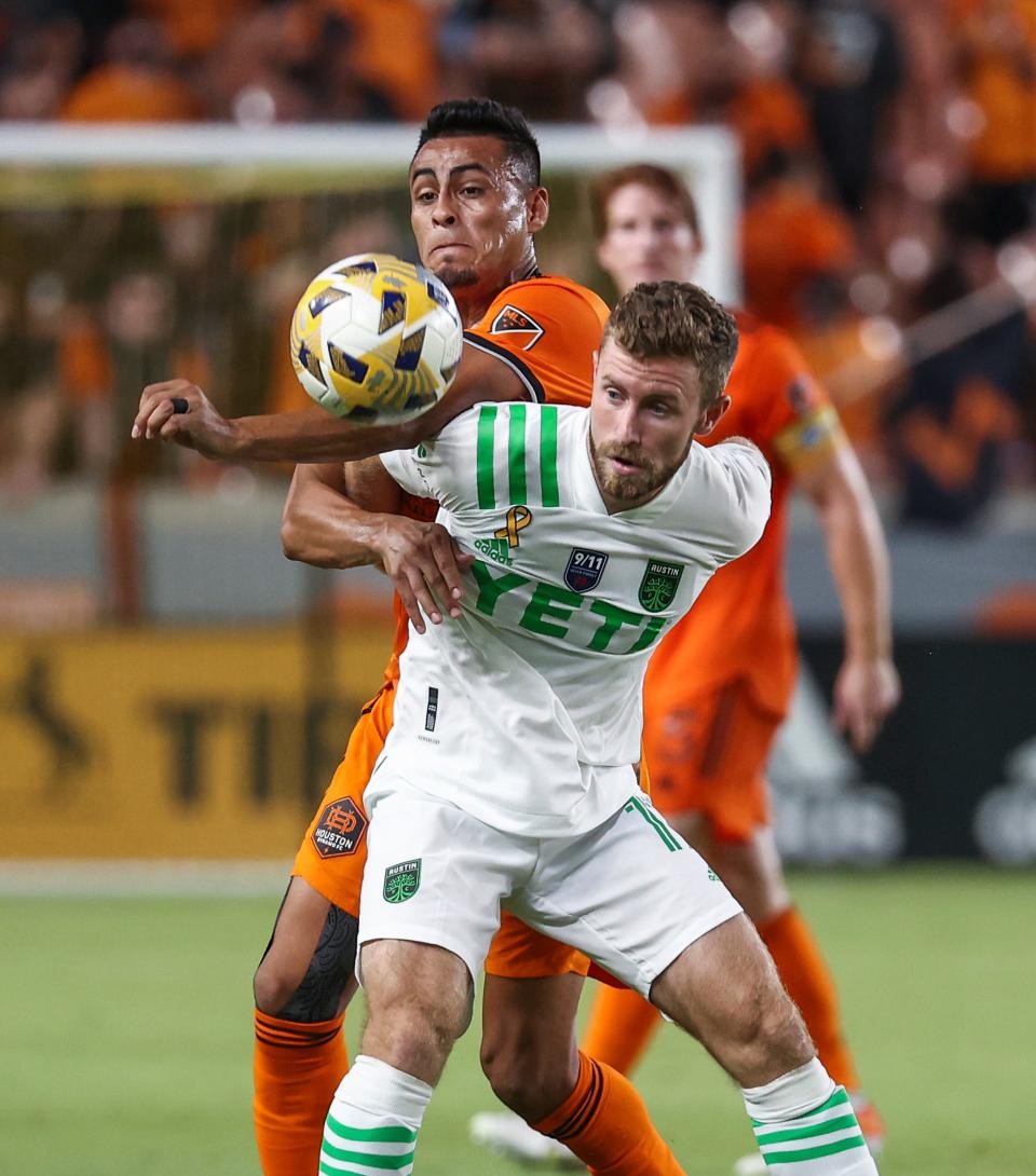 Austin FC's Jon Gallagher, front, and Houston Dynamo's Darwin Ceren battle for the ball in a 2021 match at Houston. Gallagher had a breakout year in 2022, switching from an attacking role to left back.