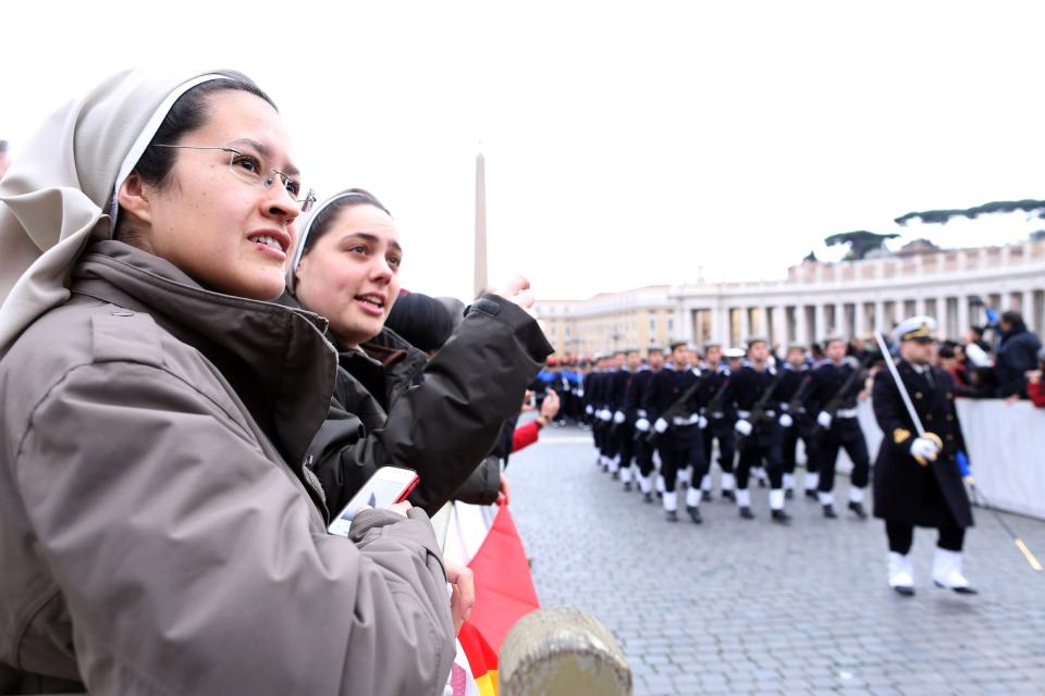 VATICAN CITY, VATICAN - DECEMBER 25: Nuns gather at St. Peter's square for the Christmas Day message 'urbi et orbi' blessing (to the city and to the world) held by Pope Benedict XVI from the central balcony of St Peter's Basilica on December 25, 2012 in Vatican City, Vatican. (Photo by Franco Origlia/Getty Images)