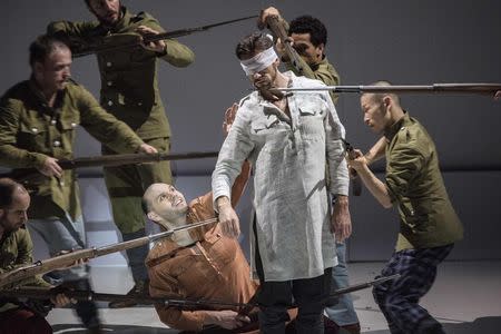 Opera singers and dancers perform on stage during a rehearsal of "Shell Shock", an opera marking the centenary of World War One, at La Monnaie Theatre in Brussels October 17, 2014, in this handout courtesy of La Monnaie. REUTERS/Filip Van Roe/La Monnaie/Handout via Reuters