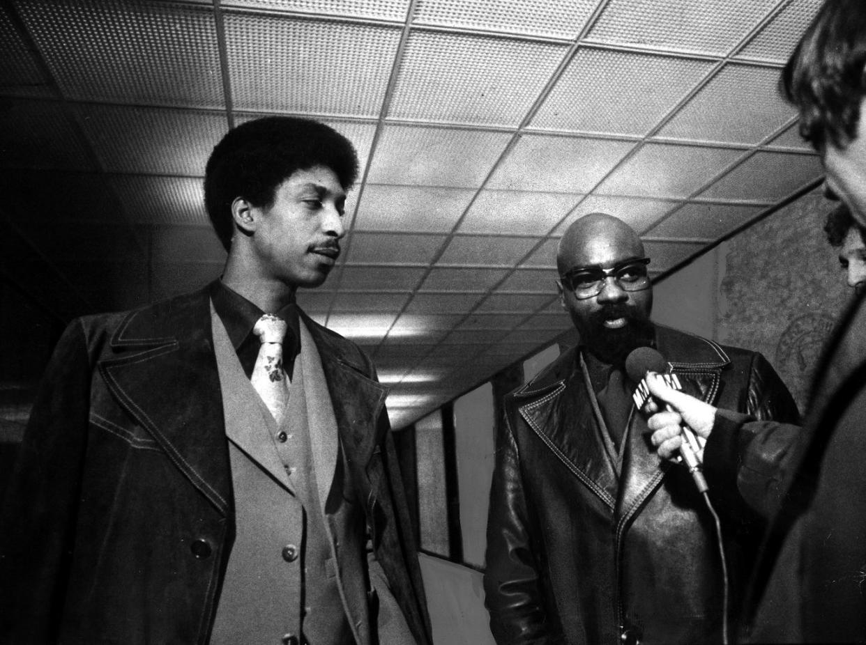 John Artis [l.] and Rubin "Hurricane" Carter are interviewed in corridor of Passaic County Courthouse.