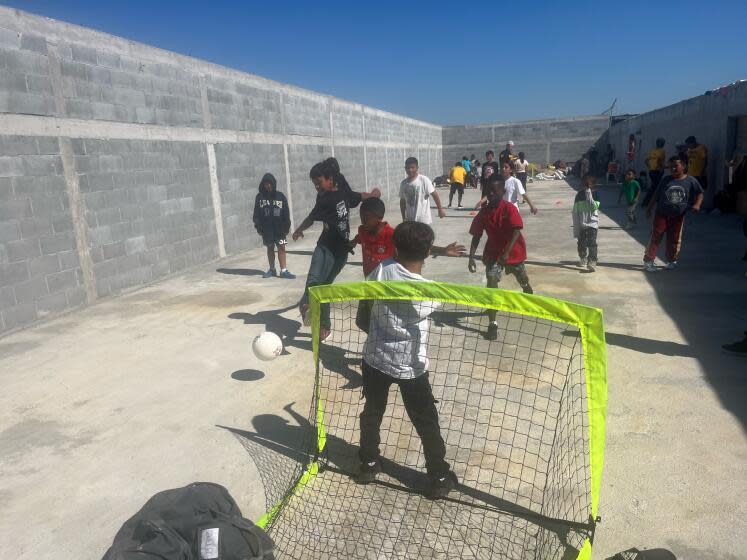 Children play soccer at the Sidewalk School in Matamoros, Mexico.