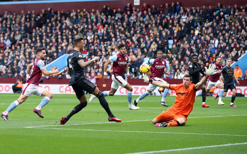 Arsenal's Ben White shoots towards goal under pressure from Aston Villa goalkeeper Emiliano Martinez (right) during the Premier League match at Villa Park, Birmingham. Picture date: Saturday February 18, 2023. (Photo by Isaac Parkin/PA Images via Getty Images)