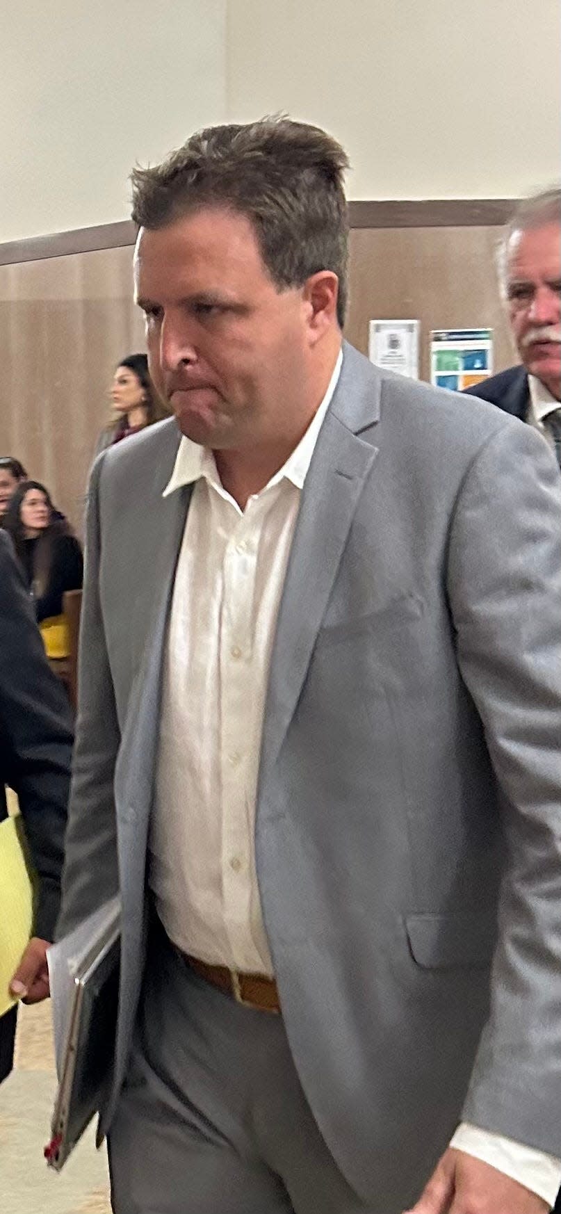 Joshua Brock, the former chief financial officer at Epic Charter Schools, walks to an Oklahoma County courtroom to continue his testimony against his bosses.