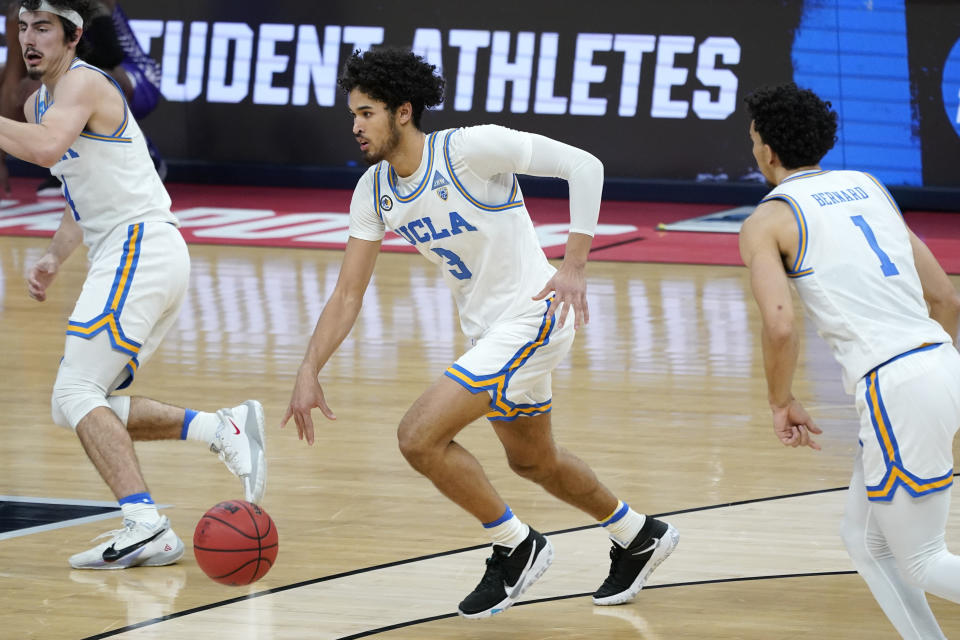 UCLA's Johnny Juzang (3) brings the ball up the court during the second half of a college basketball game against Abilene Christian in the second round of the NCAA tournament at Bankers Life Fieldhouse in Indianapolis Monday, March 22, 2021. Juzang led UCLA with 17 points as UCLA won 67-47. (AP Photo/Mark Humphrey)