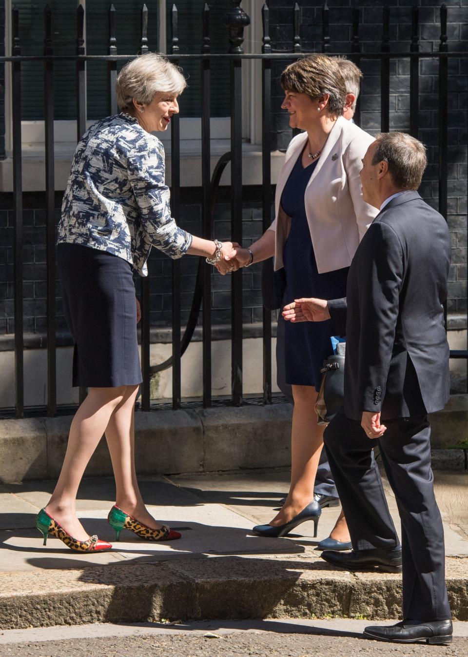 Theresa May and Arlene Foster shake hands outside number 10 (PA Images)