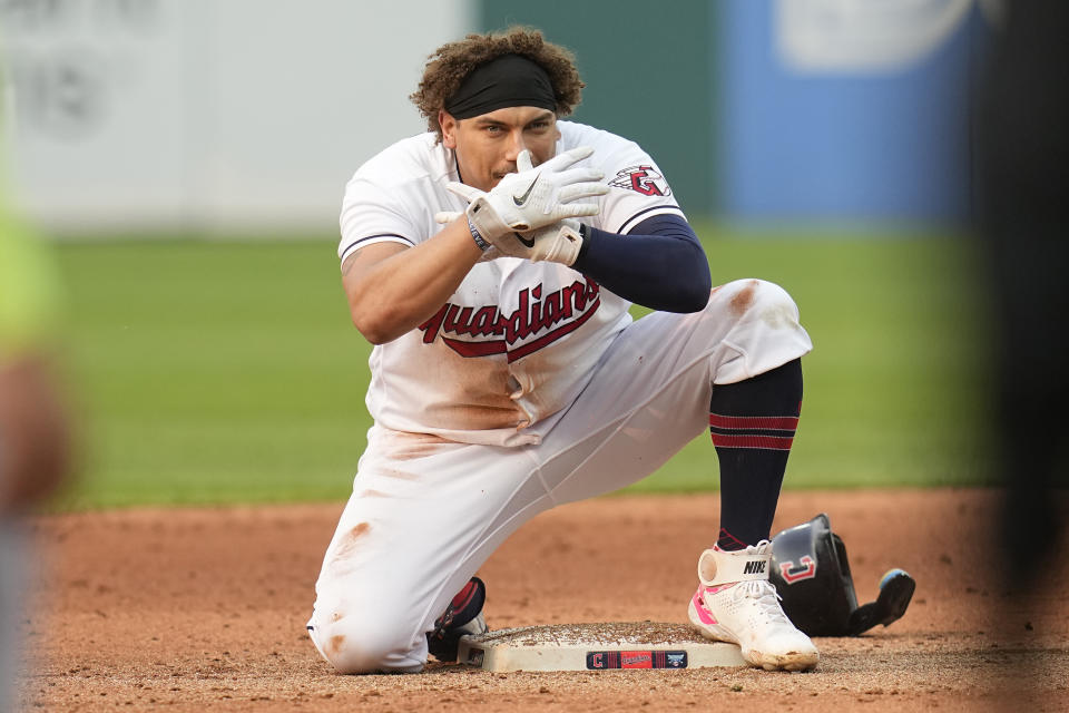 Cleveland Guardians' Josh Naylor gestures at second base after hitting an rbi-double in the sixth inning of a baseball game against the Chicago White Sox, Tuesday, May 23, 2023, in Cleveland. (AP Photo/Sue Ogrocki)