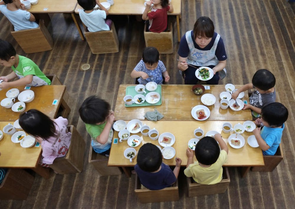 Children eat lunch at a nursery school in Yokohama, Japan. <span class="copyright">Kazuhiro Nogi—AFP/Getty Images</span>