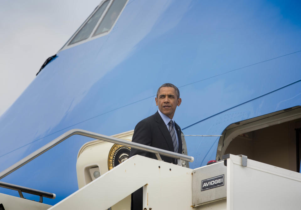 US President Barack Obama boards Air Force One on his departure at Fiumicino Airport, Friday, March 28, 2014 in Rome. Obama departs Italy for Saudi Arabia, to meet with King Abdulla, the final stop on a weeklong overseas trip. (AP Photo/Pablo Martinez Monsivais)