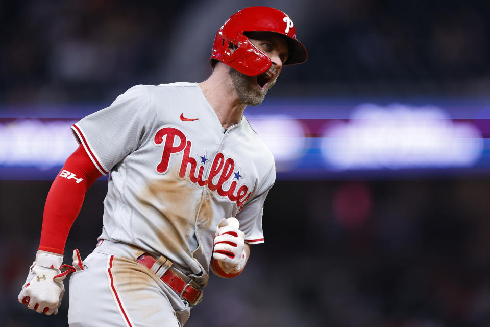 Philadelphia Phillies Bryce Harper reacts after hitting a two run home run in the ninth inning of a baseball game against the Atlanta Braves, Tuesday, May 24, 2022, in Atlanta. (AP Photo/Todd Kirkland)