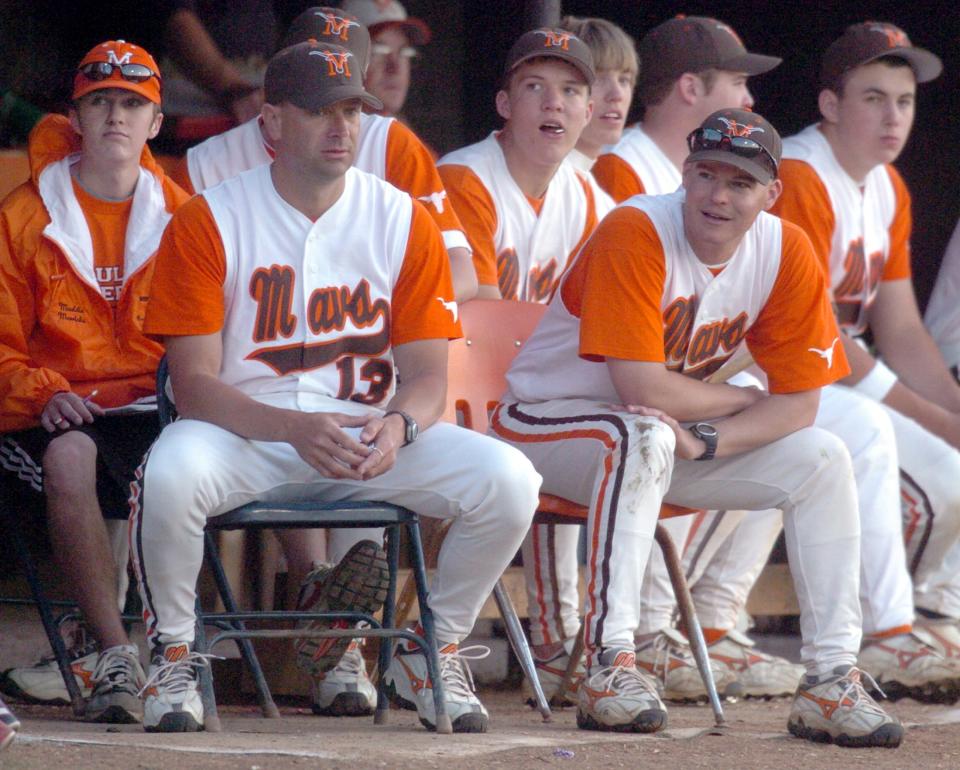 Mauldin coaches Todd Robinson, left, and Scott Freeman keep a close eye on the action. Freeman is the head coach and Robinson is the pitching coach and assistant head coach.