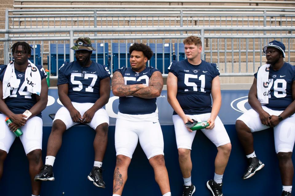 (From left) <a class="link " href="https://sports.yahoo.com/ncaaf/teams/penn-st/" data-i13n="sec:content-canvas;subsec:anchor_text;elm:context_link" data-ylk="slk:Penn State football;sec:content-canvas;subsec:anchor_text;elm:context_link;itc:0">Penn State football</a> offensive linemen Olumuyiwa Fashanu, Ibrahim Traore, Nick Dawkins, Jimmy Christ and Golden Israel-Achumba participate in football media day at Beaver Stadium in 2022. Syndication: York Daily Record