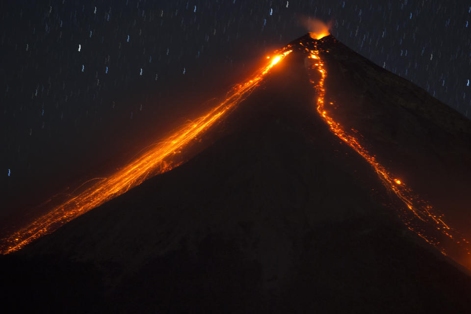 FILE - In this Jan. 4, 2016, file photo, the Volcano of Fire releases lava, seen from Escuintla, Guatemala. In Spanish it's known as "El Volcan del Fuego." (AP Photo/Moises Castillo, File)