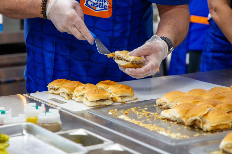 Employees make sliders the White Castle way.