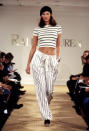 <p>Christy wears matching stripes on the runway at the Ralph Lauren Spring Show, 1993</p>