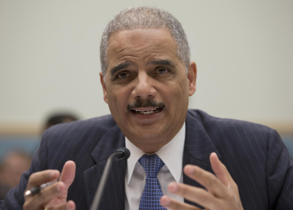 Attorney General Eric Holder gestures while testifying on Capitol Hill in Washington, Wednesday, May 15, 2013, before the House Judiciary Committee oversight hearing on the Justice Department. Holder told Congress Wednesday that a serious national security leak required the secret gathering of telephone records at The Associated Press as he stood by an investigation in which he insisted he had no involvement. (AP Photo/Carolyn Kaster)