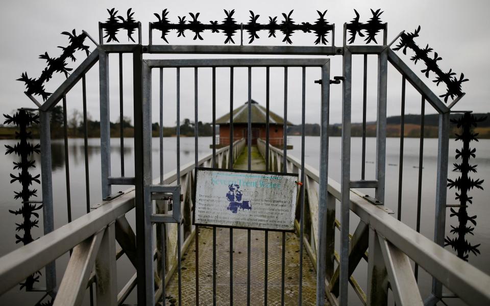 A sign hangs on a gate at Severn Trent Water's Cropston Reservoir in Leicestershire