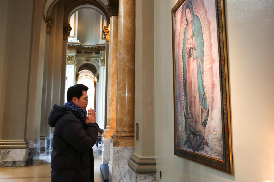 Jun Lee, a Catholic from South Korea, prays during a visit to St. James Cathedral, which is only open for prayer after the Archdiocese of Seattle canceled all public celebration of Mass at all parishes due to the coronavirus in Seattle, Washington, on March 12. (Photo: JASON REDMOND / Reuters)