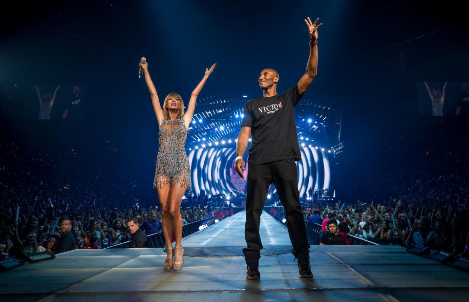 Taylor Swift and Kobe Bryant onstage during The 1989 World Tour Live in Los Angeles at the then-Staples Center on Aug. 21, 2015. (Christopher Polk/Getty Images for TAS)