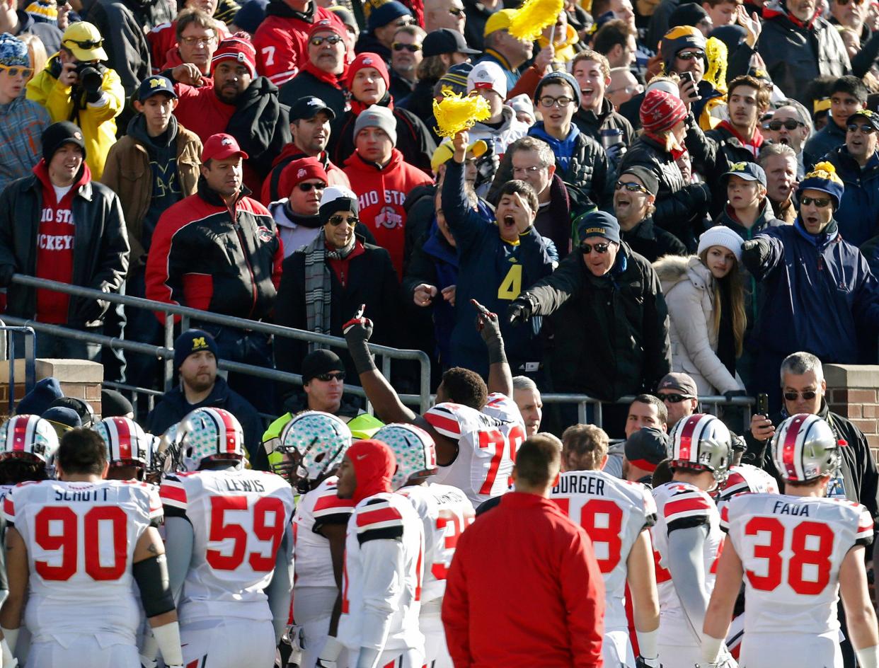 Ohio State offensive linesman Marcus Hall reacts after being ejected from the Buckeyes' 42-41 win at Michigan in 2013.