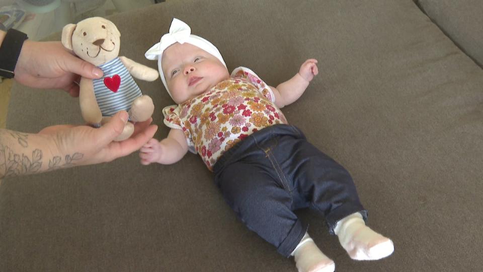 Sutton on May 16, reaching for her teddy bear.