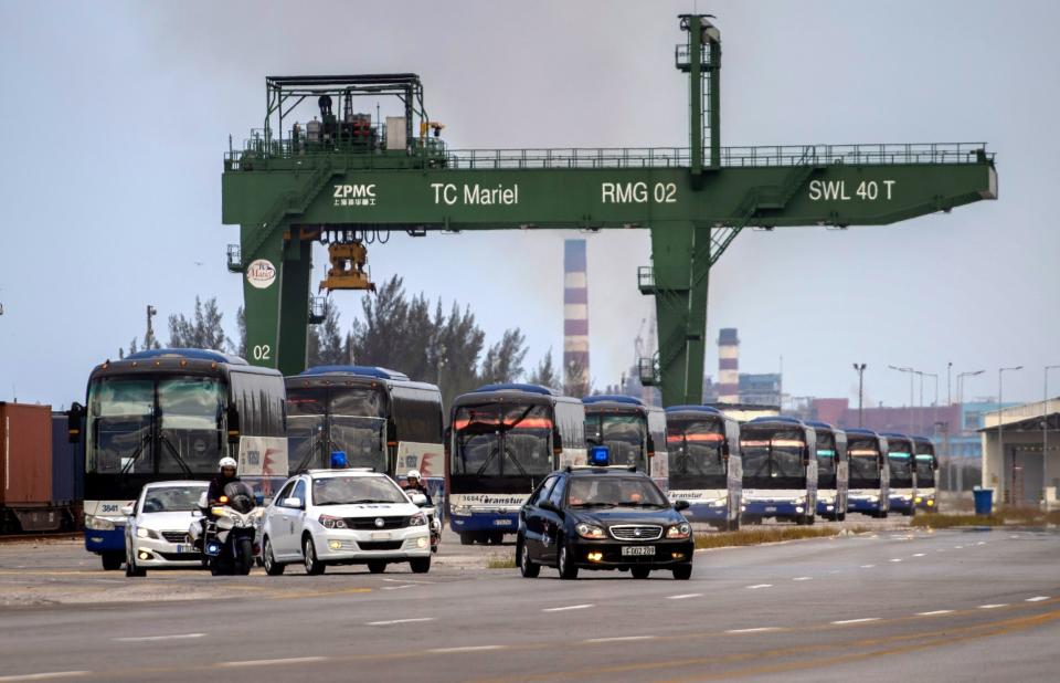 Buses escorted by the police transport the passengers of the British cruise ship MS Braemar to the Jose Marti International Airport, from Puerto del Mariel, Cuba, where the vessel was allowed to dock: EPA