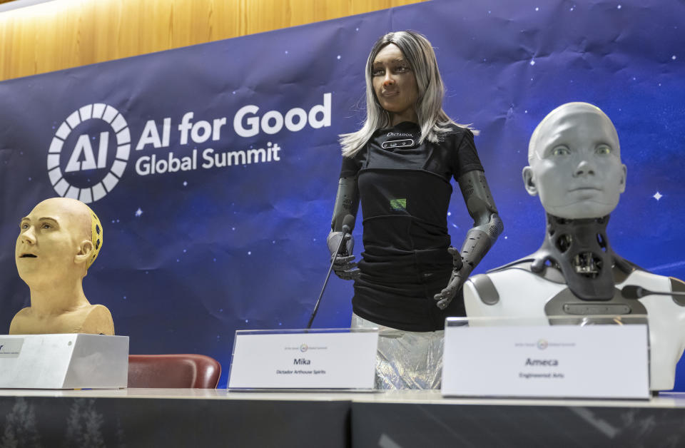 Robots are seen on the podium during a press conference with a panel of AI-enabled humanoid social robots as part of International Telecommunication Union (ITU) 'AI for Good' global summit in Geneva, Switzerland, Friday, July 07, 2023. Nine AI-enabled humanoid robots sat or stood with their creators at a podium in a Geneva conference center on Friday for what the United Nations’ International Telecommunication Union billed as the world’s first news conference featuring humanoid social robots. (Martial Trezzini/Keystone via AP)