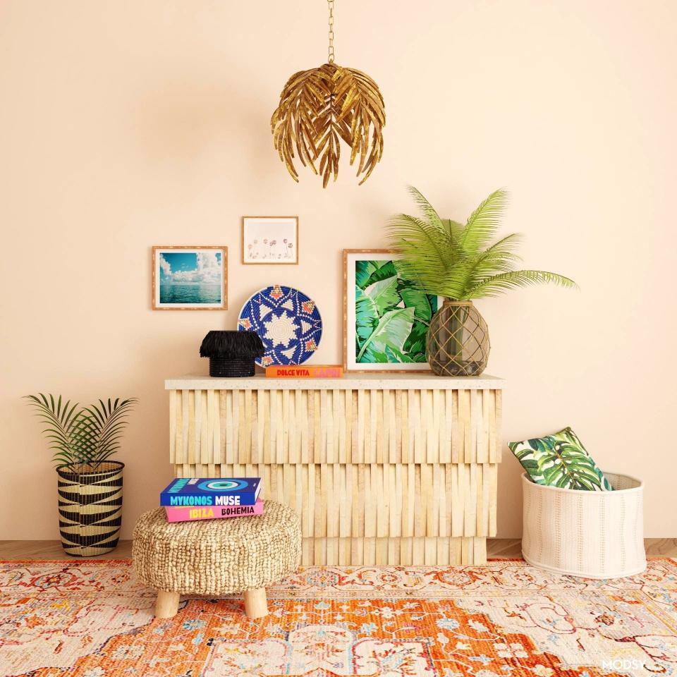 This undated photo rendering provided by Modsy shows a room decorated like an island getaway. Alessandra Wood, founder of online interior design platform Modsy, says you can invoke the vibe of your favorite island getaway through some well-chosen prints and materials. "Look for pieces that have a subtle tropical vibe via foliage, like palms, as well as natural raw wood or rattan textures, and fun global prints." To achieve a coastal getaway look, Wood suggests opting for layers of serene blues and seafoam greens paired with neutral hues. "This will evoke the sea and the sand and create a calming backdrop. To really feel like you're on a beach getaway incorporate sea themed items such as prints, sculptures, and objects that depict shells and sea life." (Modsy via AP)