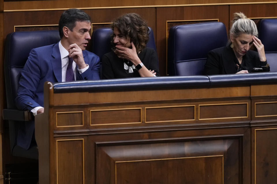 From left to right: Spain's Socialist Prime Minister Pedro Sanchez, Spain's Deputy Prime Minister and Ministry of Finance Maria Jesus Montero and Spain's second Deputy Prime Minister and Labour Minister Yolanda Diaz at the Spanish Parliament in Madrid, Spain, Thursday, March 14, 2024. Prime Minister Pedro Sánchez has promoted the amnesty as a way to move past a secession attempt by the then-leaders of Catalonia, a northeastern region centered around Barcelona where many speak the local Catalan language as well as Spanish. The conservative opposition accuses Sanchez of selling out the rule of law in exchange for another term in the Moncloa Palace and has organized major street protests during recent months. (AP Photo/Manu Fernandez)