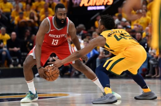 Donovan Mitchell (R) of the Utah Jazz knocks the ball from the hands of James Harden of the Houston Rockets during game four of the playoffs
