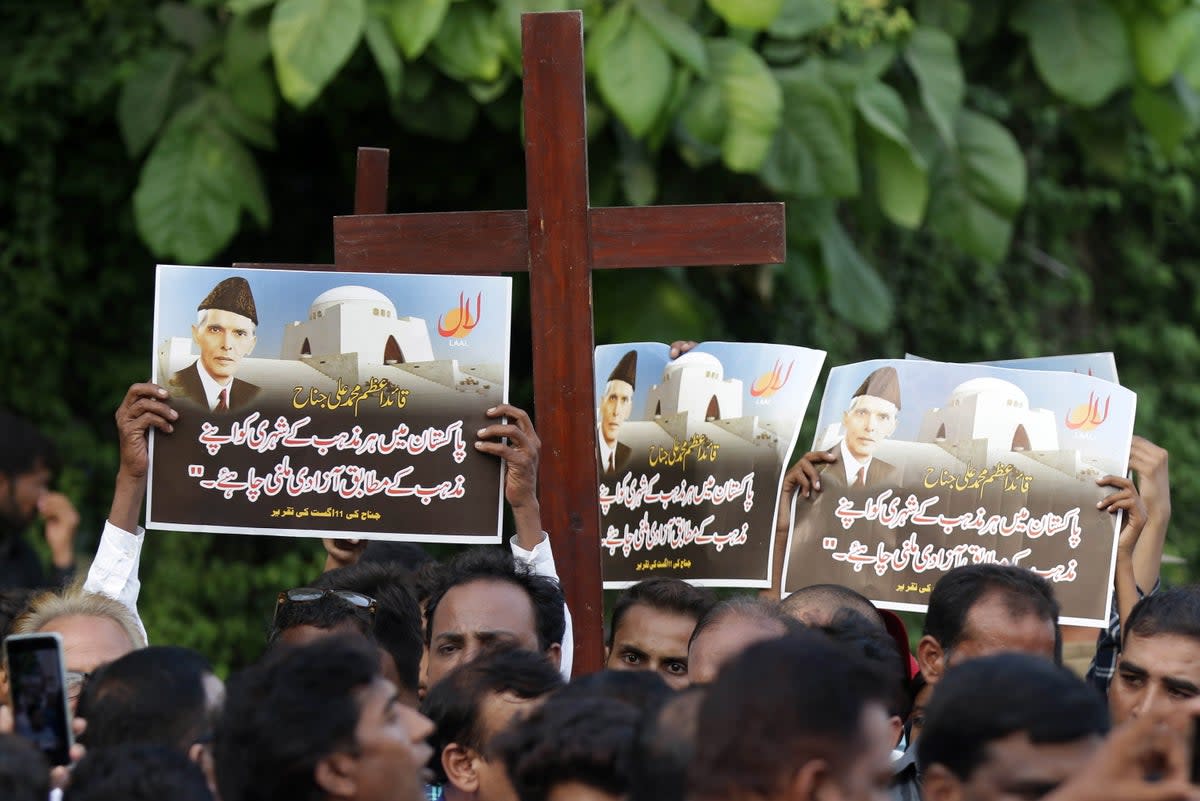 Members of the Christian minority protest against sectarian violence (EPA)