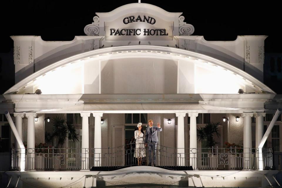<p>After the ceremony, the royal couple greets the public from the balcony of the Grand Pacific Hotel. Queen Elizabeth and Prince Philip greeted the crowd from the same spot in 1953.</p>