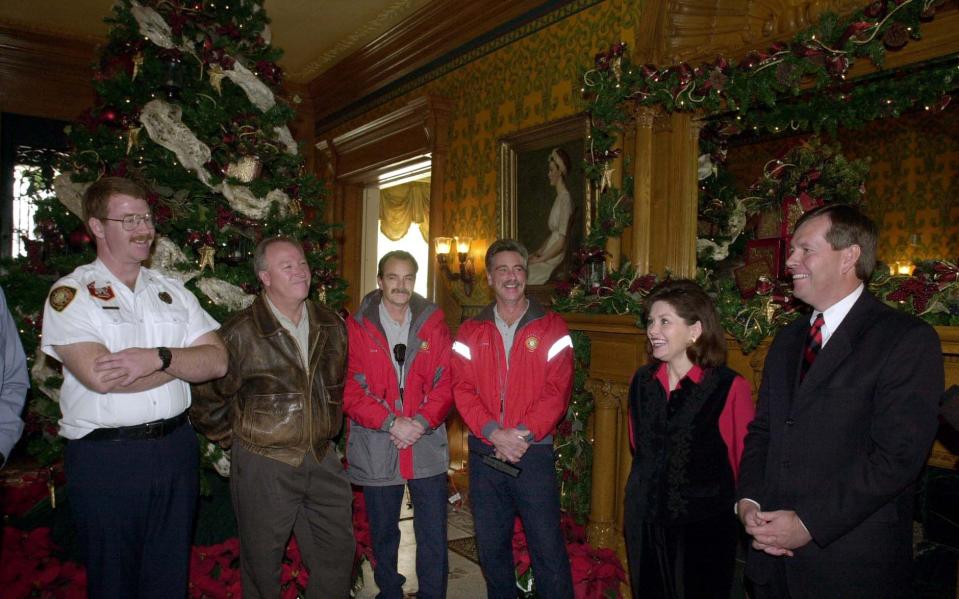 Fire Marshall Dan Andrus, Batallion Chief Roger Stroud, Capt. Dave Reeves and Capt. Bob Layton talk with Jacalyn and Gov. Mike Leavitt at the Governor’s Mansion in this undated file photo. After a fire in December 1993 in Salt Lake City, it took 30 months to restore the historic mansion. | Ravell Call, Deseret News