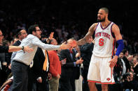 NEW YORK, NY - FEBRUARY 15: Tyson Chandler #6 of the New York Knicks celebrates with fans against the Sacramento Kings at Madison Square Garden on February 15, 2012 in New York City.