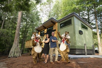 Senior vice president and general manager of Disney Vacation Club, Bill Diercksen,and Disney's Fort Wilderness Resort & Campground General Manager, Lauren Gossett, commemorate the opening The Cabins of Disney's Fort Wilderness Resort. 
© Disney