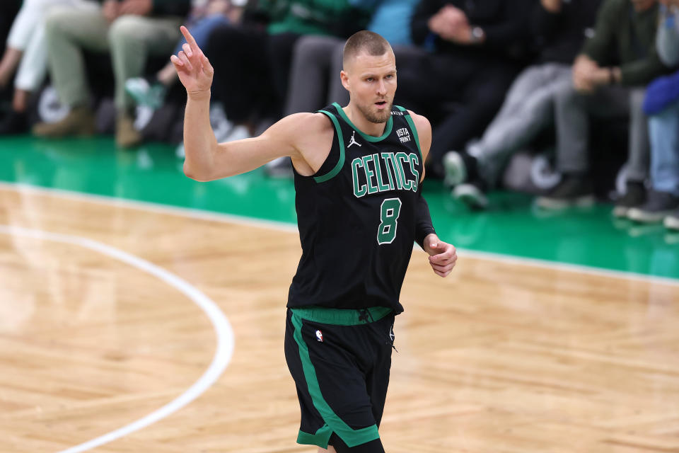 BOSTON, MASSACHUSETTS - JUNE 09: Kristaps Porzingis #8 of the Boston Celtics reacts during the first quarter against the Dallas Mavericks in Game Two of the 2024 NBA Finals at TD Garden on June 09, 2024 in Boston, Massachusetts. NOTE TO USER: User expressly acknowledges and agrees that, by downloading and or using this photograph, User is consenting to the terms and conditions of the Getty Images License Agreement. (Photo by Adam Glanzman/Getty Images)