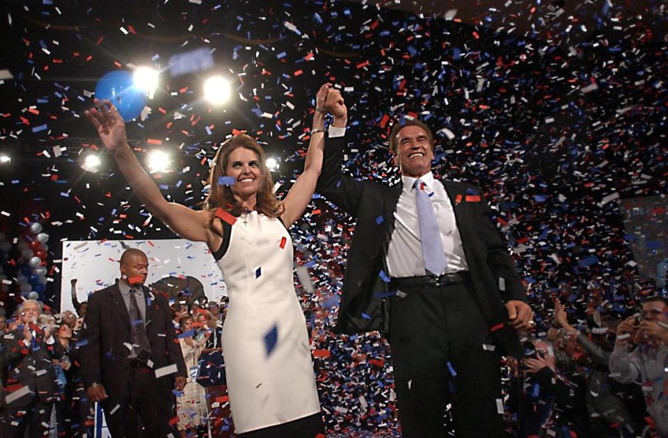 Arnold Schwarzenegger is joined by his wife Maria Shriver in Los Angeles on Oct. 7, 2003, as he celebrates his victory in the California gubernatorial recall election.
