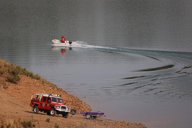 Portuguese firefighters work onboard a boat during a new search operation amid the investigation into the disappearance of Madeleine McCann (Maddie) in the Arade dam, in Silves, near Praia da Luz, on 23 May, 2023. This operation stems from a European Investigation Order addressed by the German authorities to Portugal and focuses on the Arade dam, located about 50 kilometers from Praia da Luz, the place where the child disappeared in May 2007, 16 years ago, while on vacation with her parents. (Photo by FILIPE AMORIM / AFP) (Photo by FILIPE AMORIM/AFP via Getty Images)